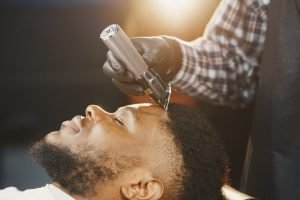 002-300x200 Young African-american man visiting barbershop